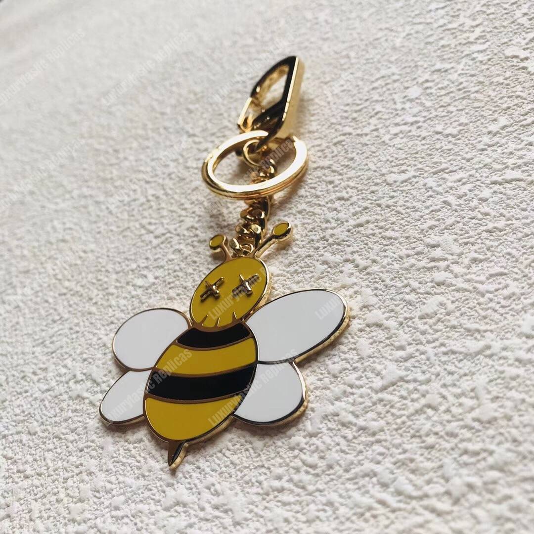 D*or x kaws bee key ring in brass & resin