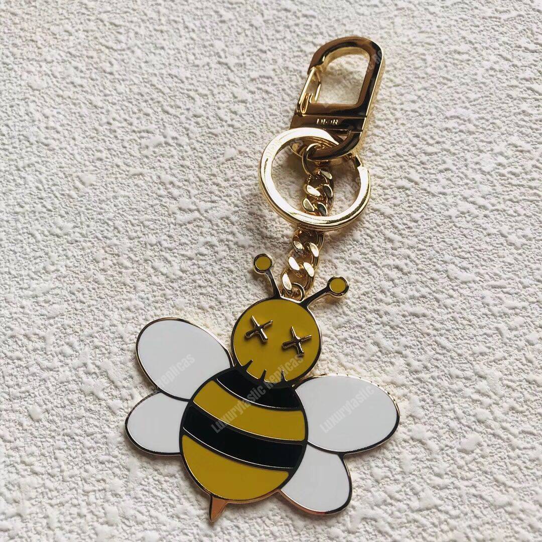 D*or x kaws bee key ring in brass & resin