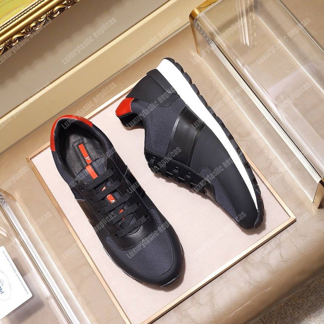 Pra*a fabric and leather sneakers blue/black/orange