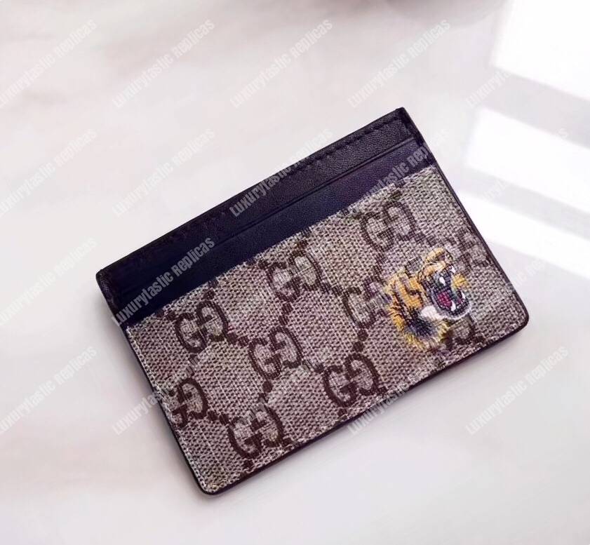 G*u*i tiger print gg sup*e card case